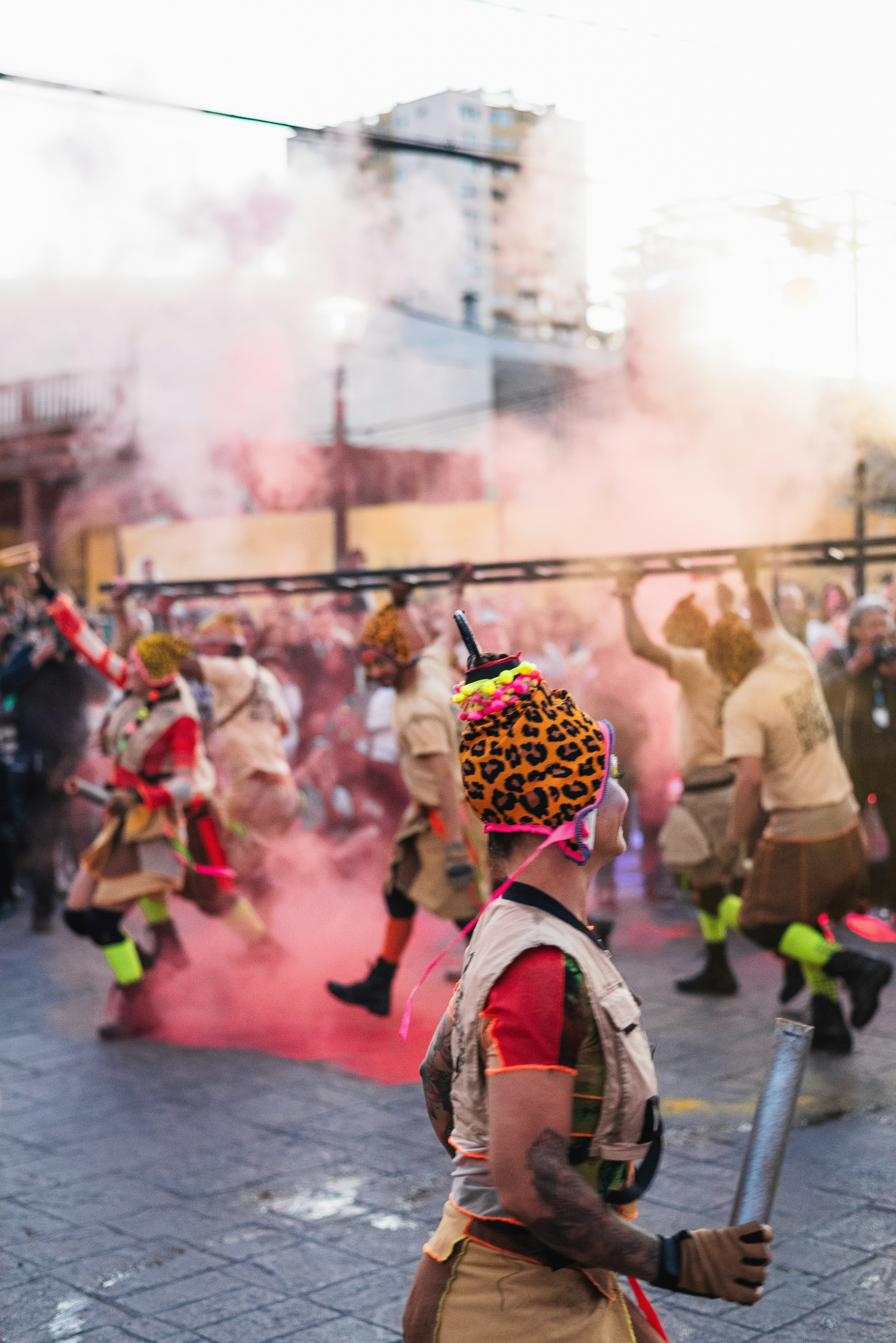 A group of people in costume walking down a street