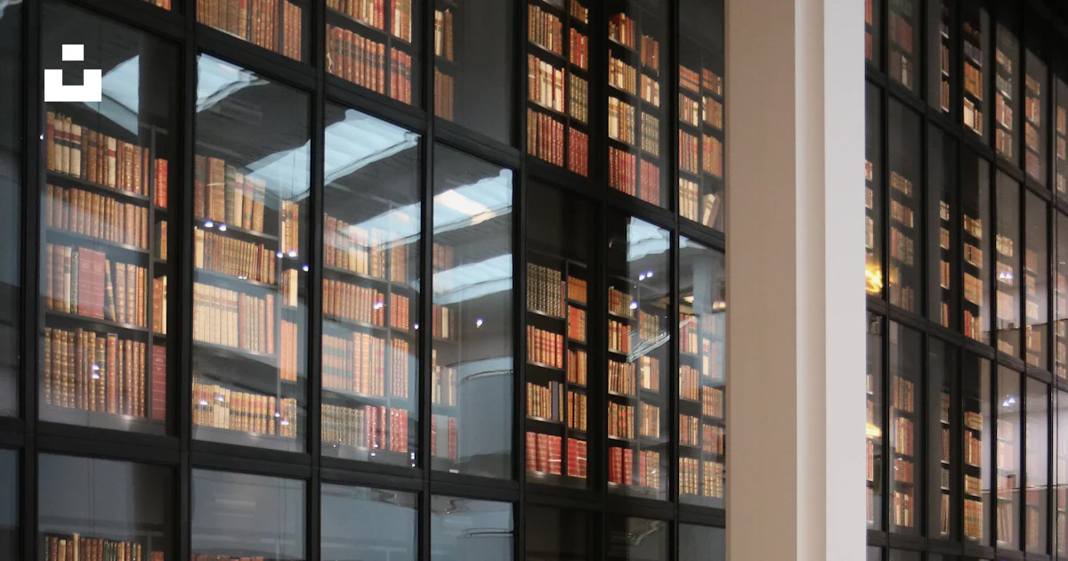A staircase leading to a library filled with lots of books photo – Free ...