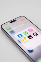 A close up of an iPhone on a white surface