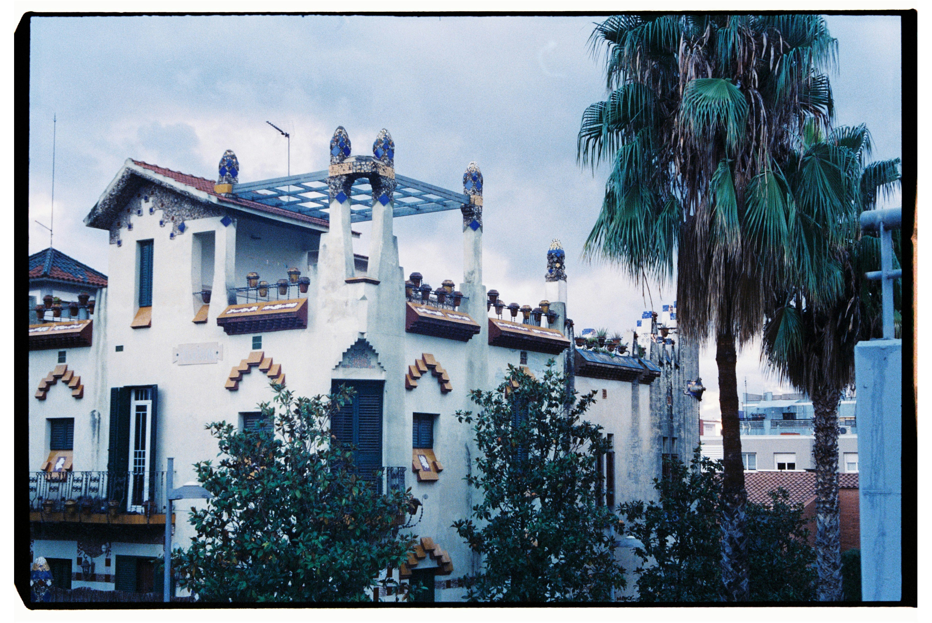 A large white building with a clock tower, 