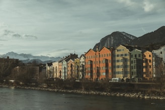 A river running through a city next to tall buildings