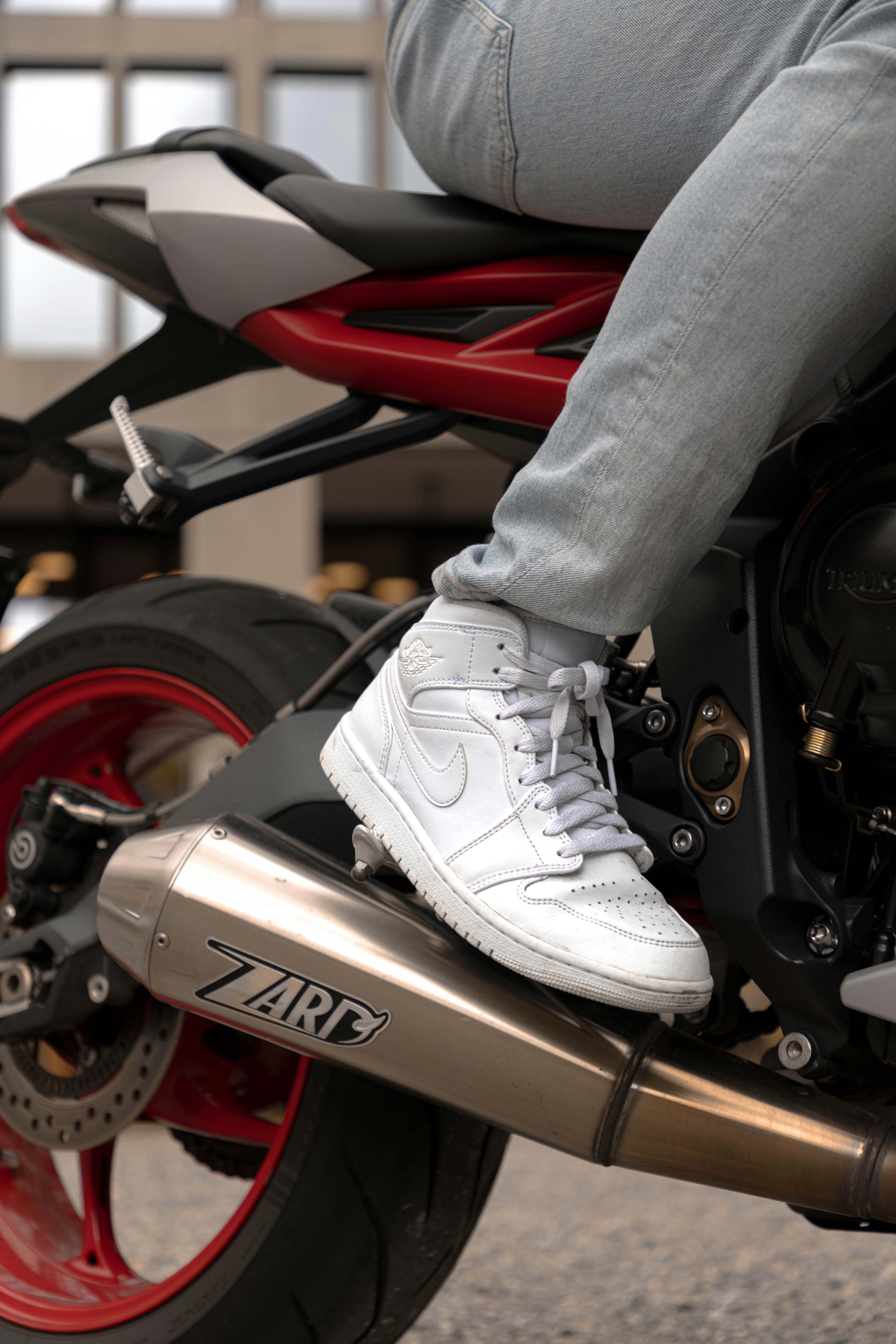 A person riding a motorcycle on a city street
