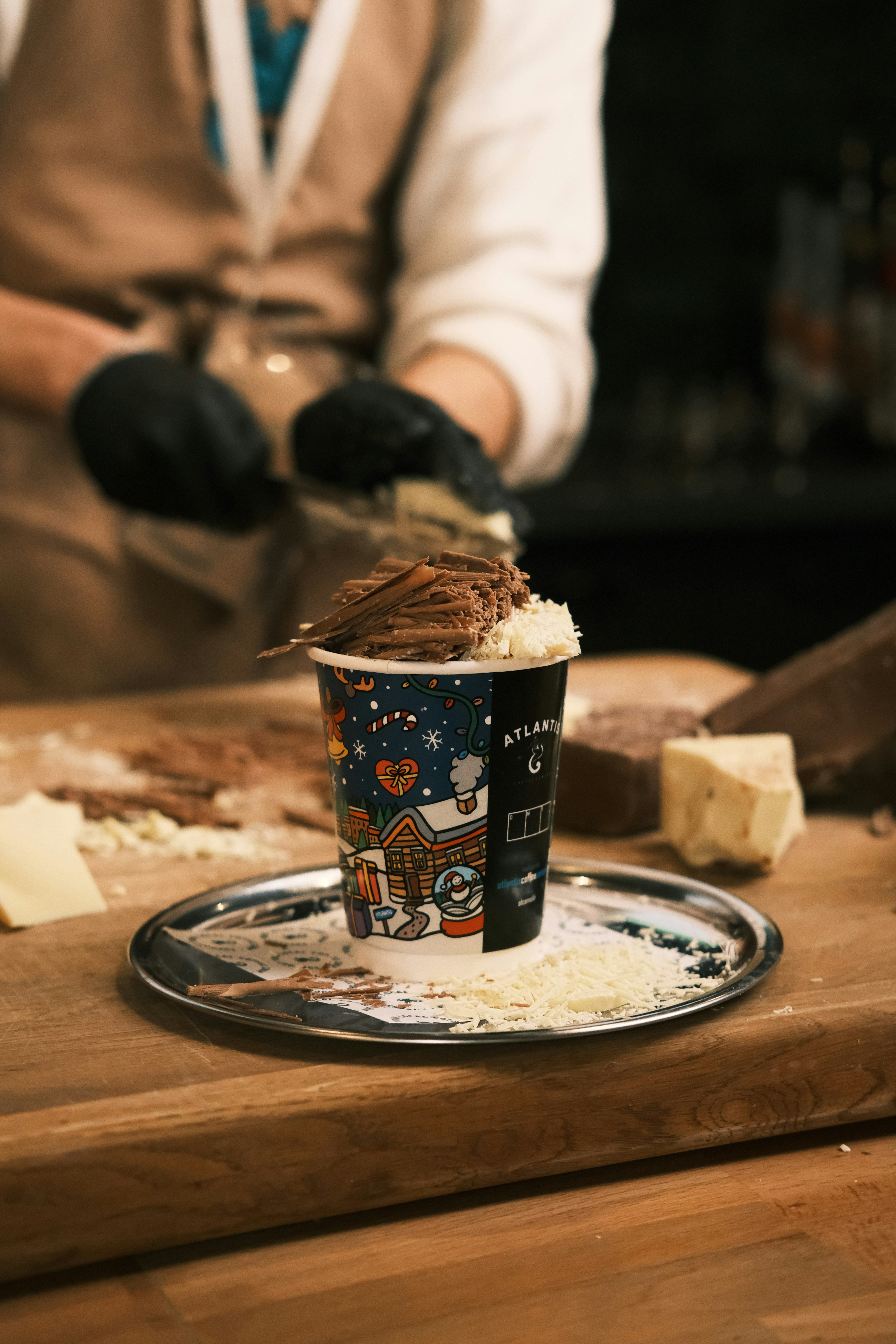 A cup of ice cream sitting on top of a wooden table