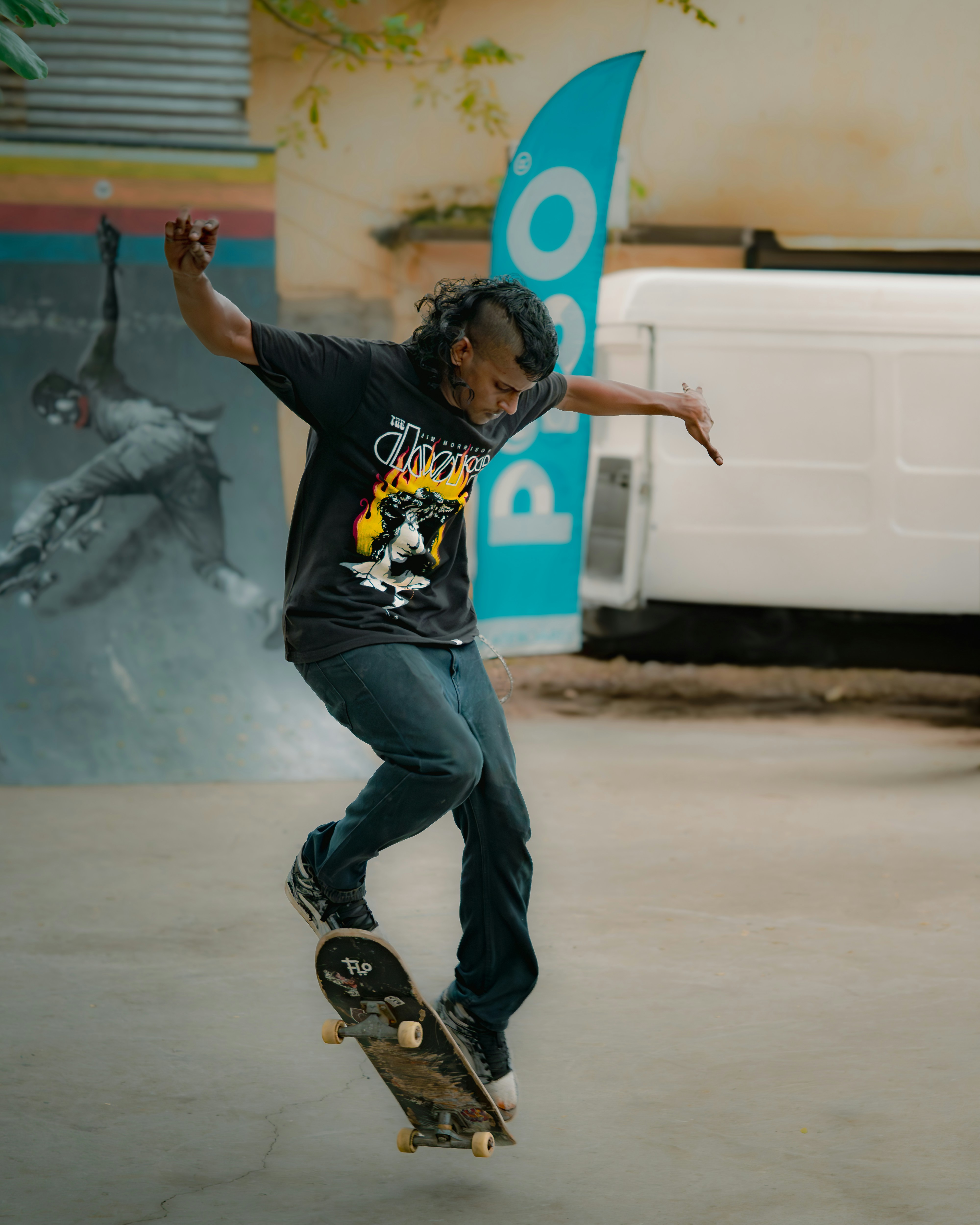 A man riding a skateboard in a parking lot