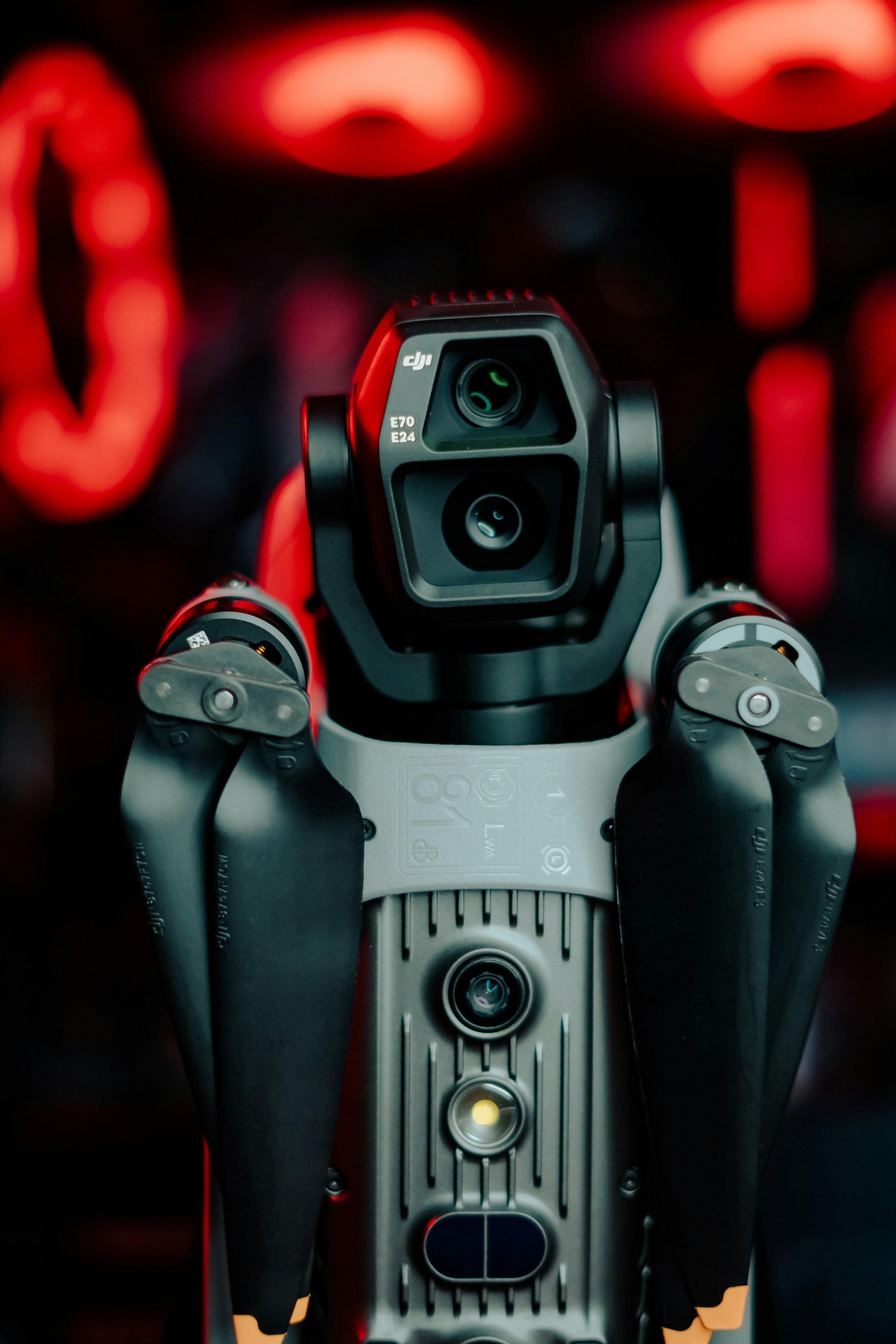 Close-up of a camera with a red light background, Branimo photography equipment.