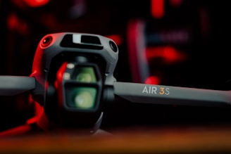 A camera sitting on top of a wooden table