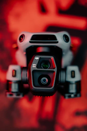 A close up of a camera with a red background