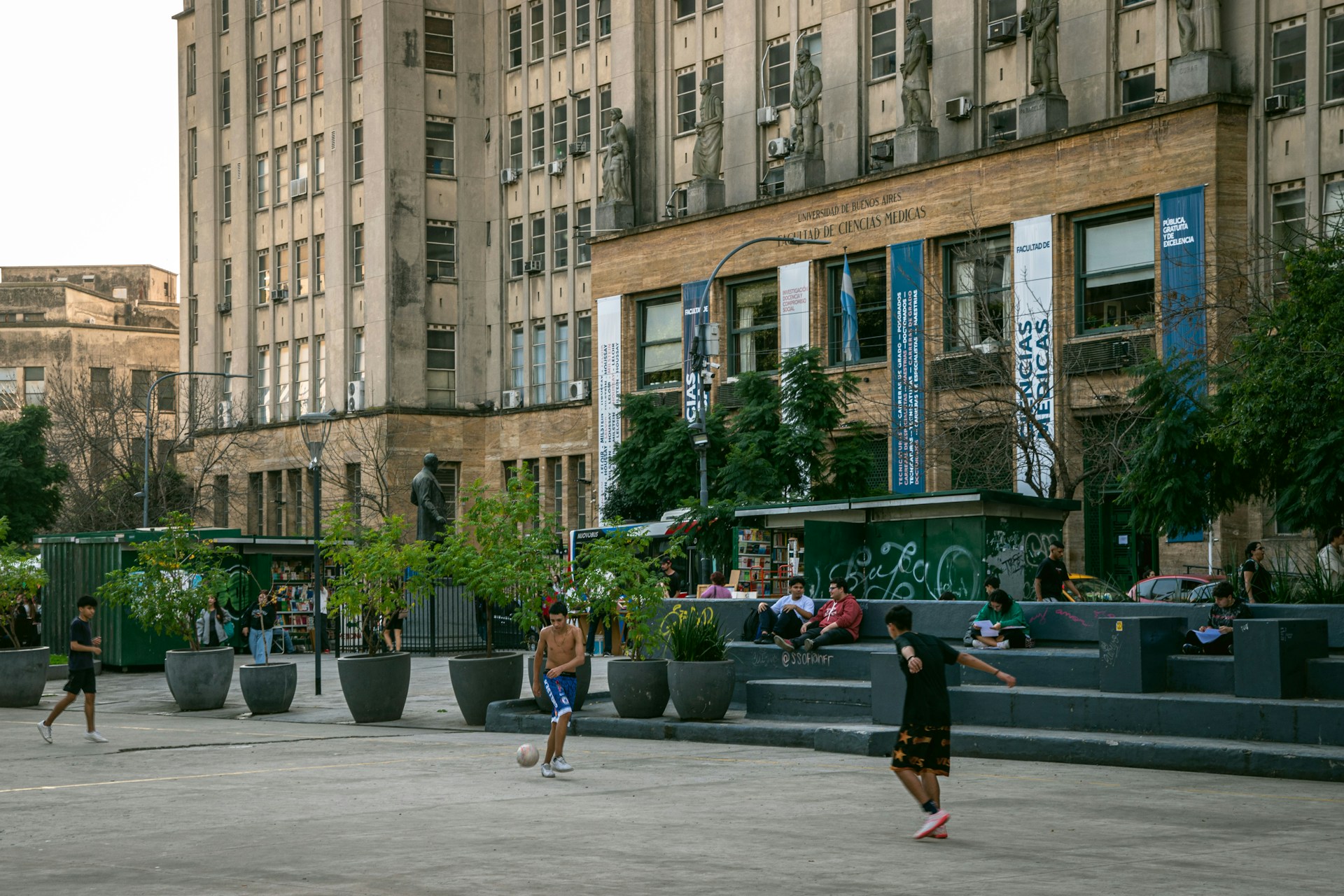 A group of people walking around a city square
