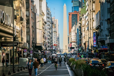 A city street filled with lots of tall buildings