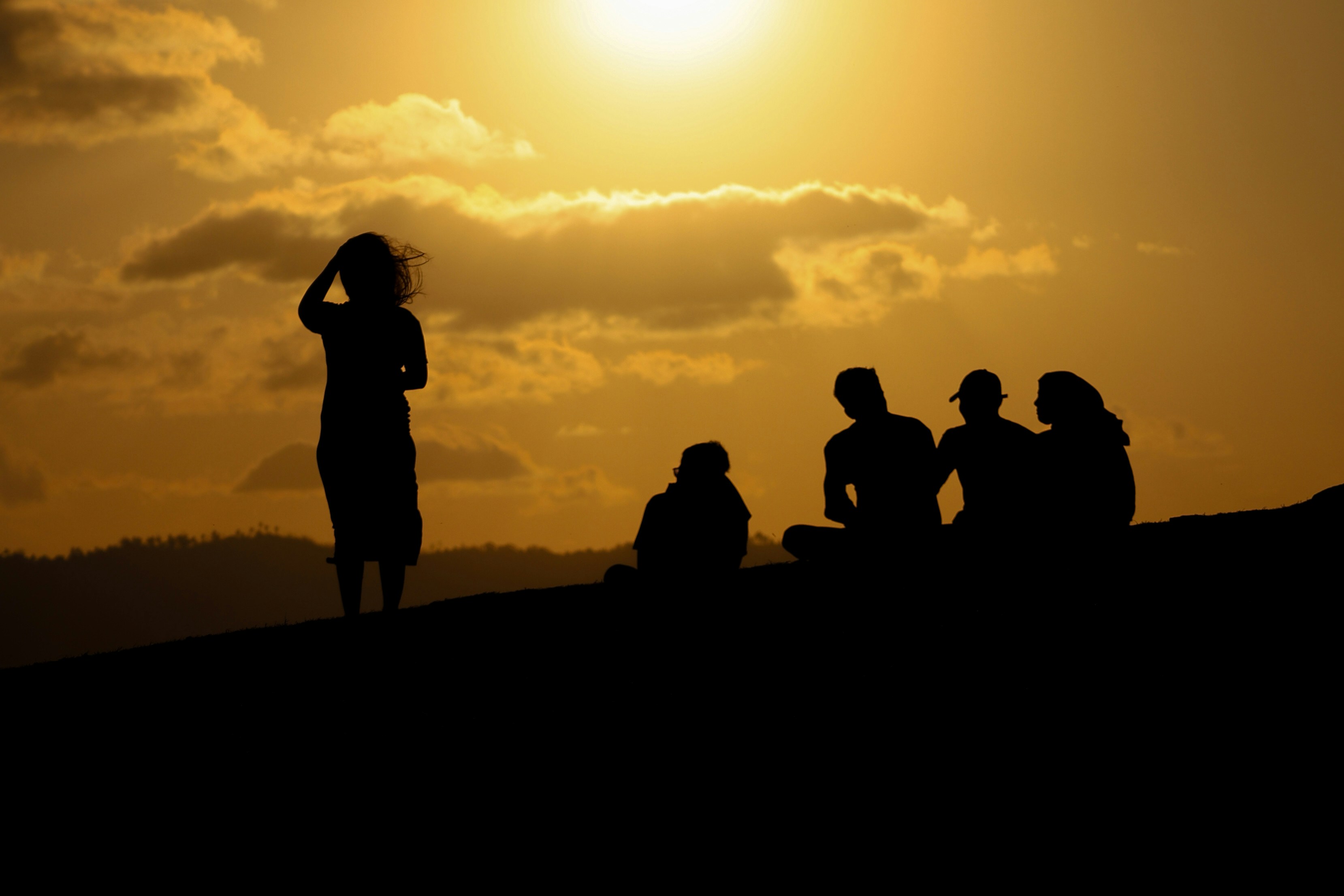 Group of friends during sunset meditation
