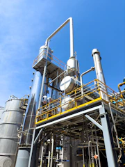 A factory with a lot of pipes and tanks