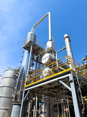 A factory with a lot of pipes and tanks