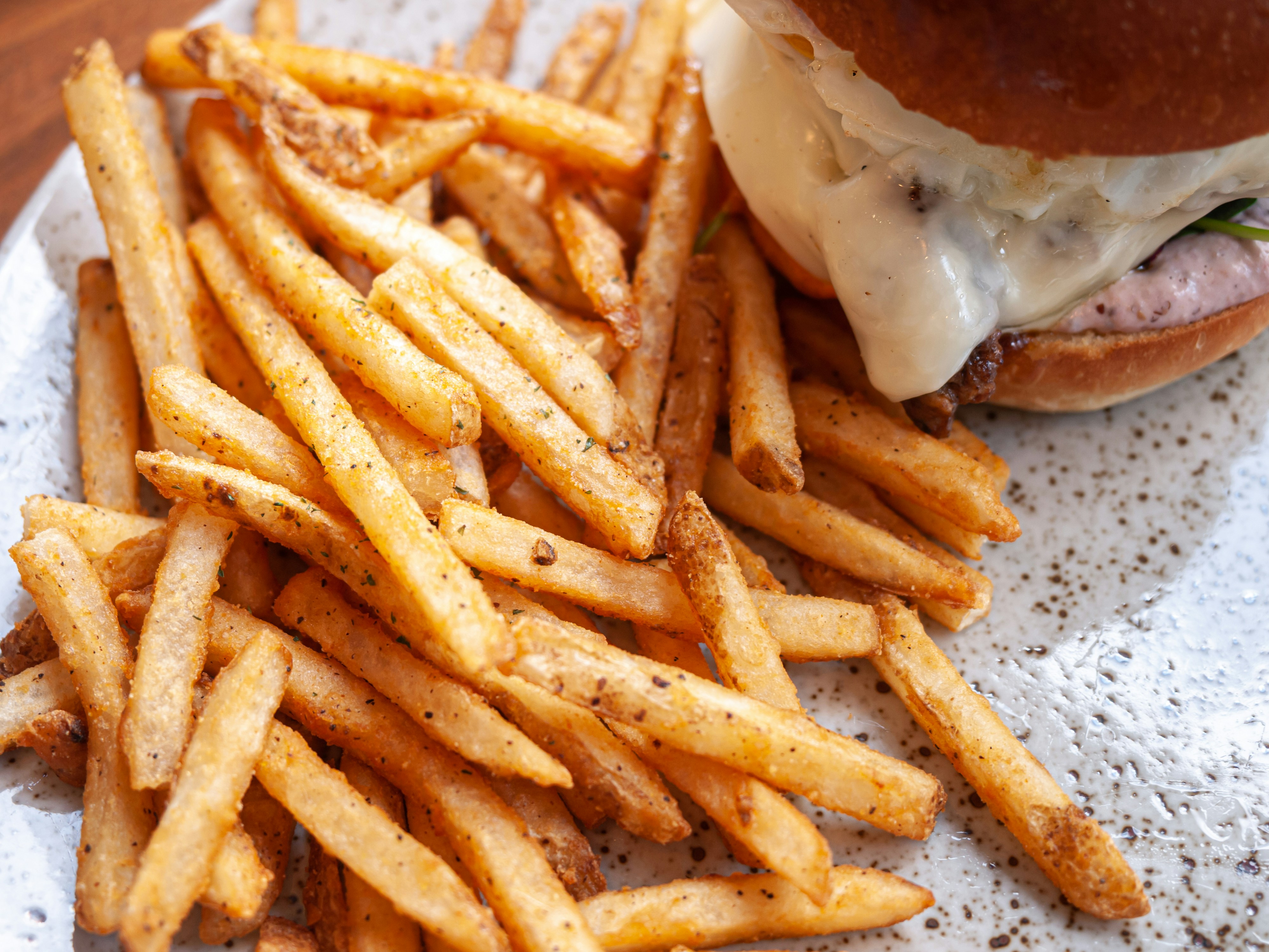 A sandwich and french fries on a plate