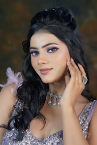 A woman in a purple dress posing for a picture