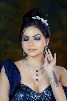 A woman wearing a blue dress and a tiara