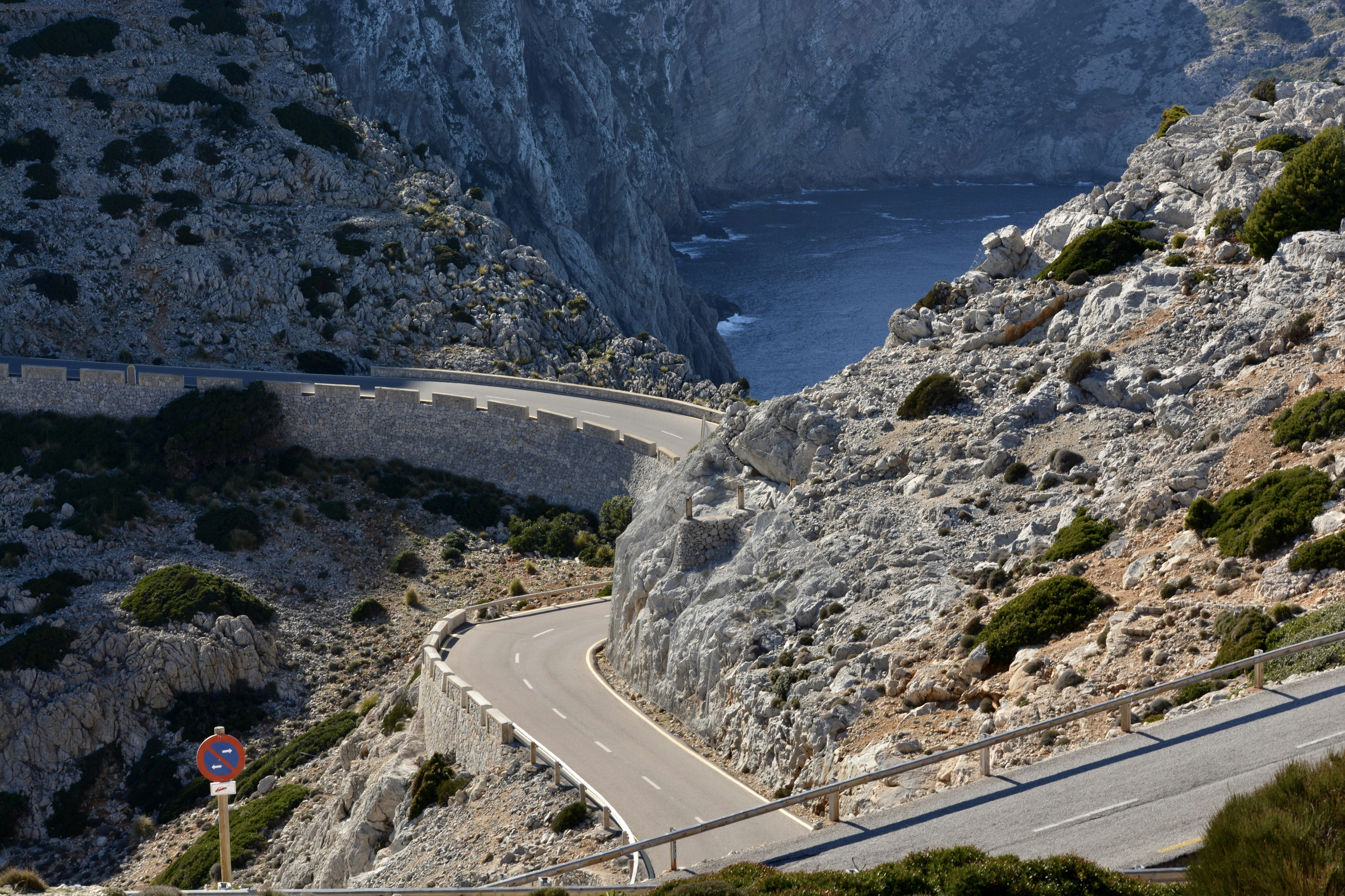 A winding road on the side of a mountain
