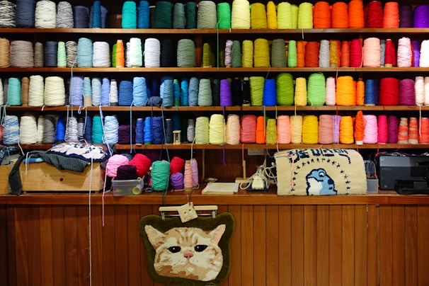 A room filled with lots of different colored spools of thread