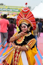 A man dressed in a costume standing in front of a crowd