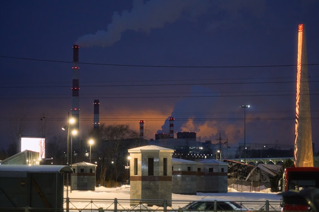 A factory with a lot of smoke coming out of it