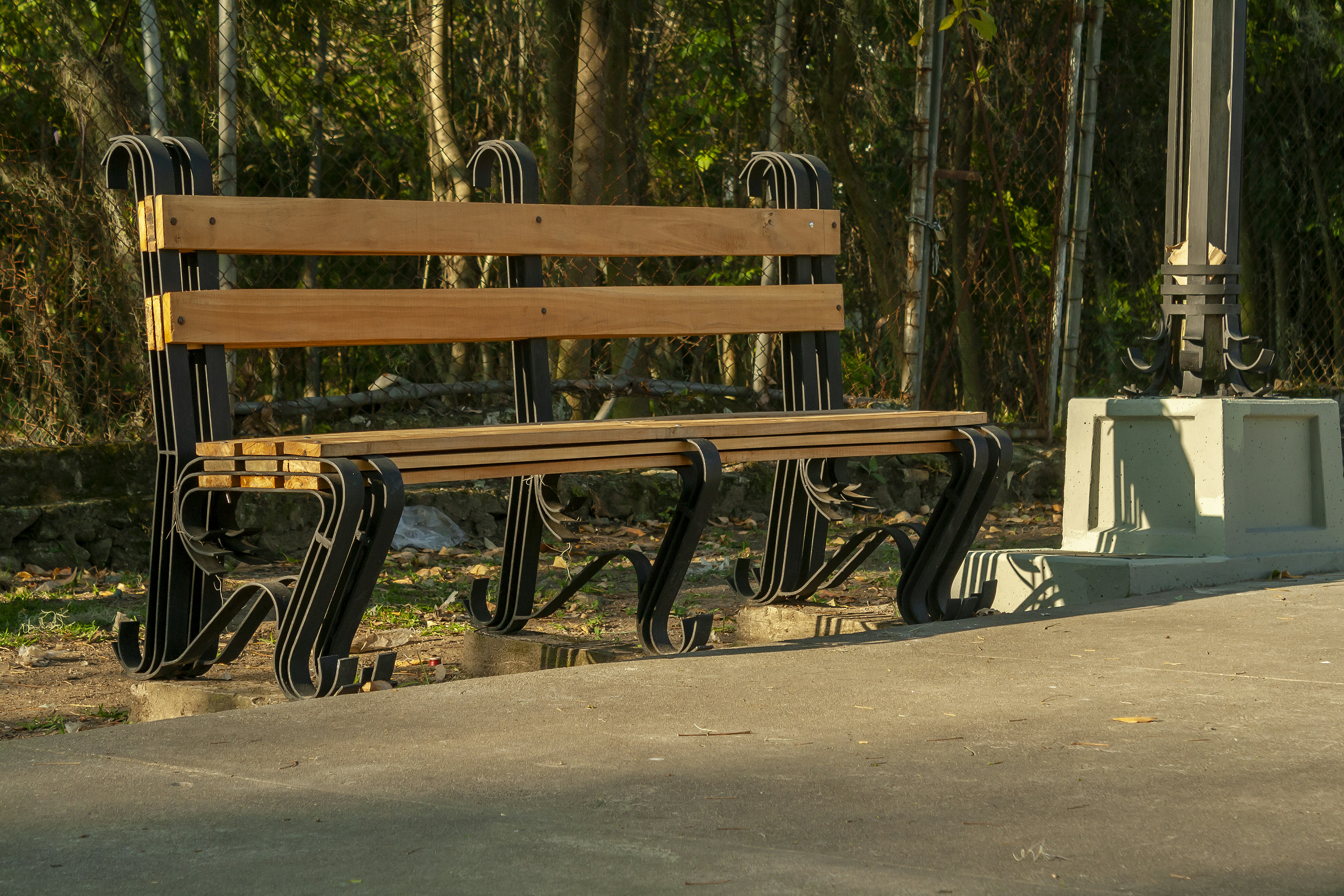 A wooden bench sitting in the middle of a park