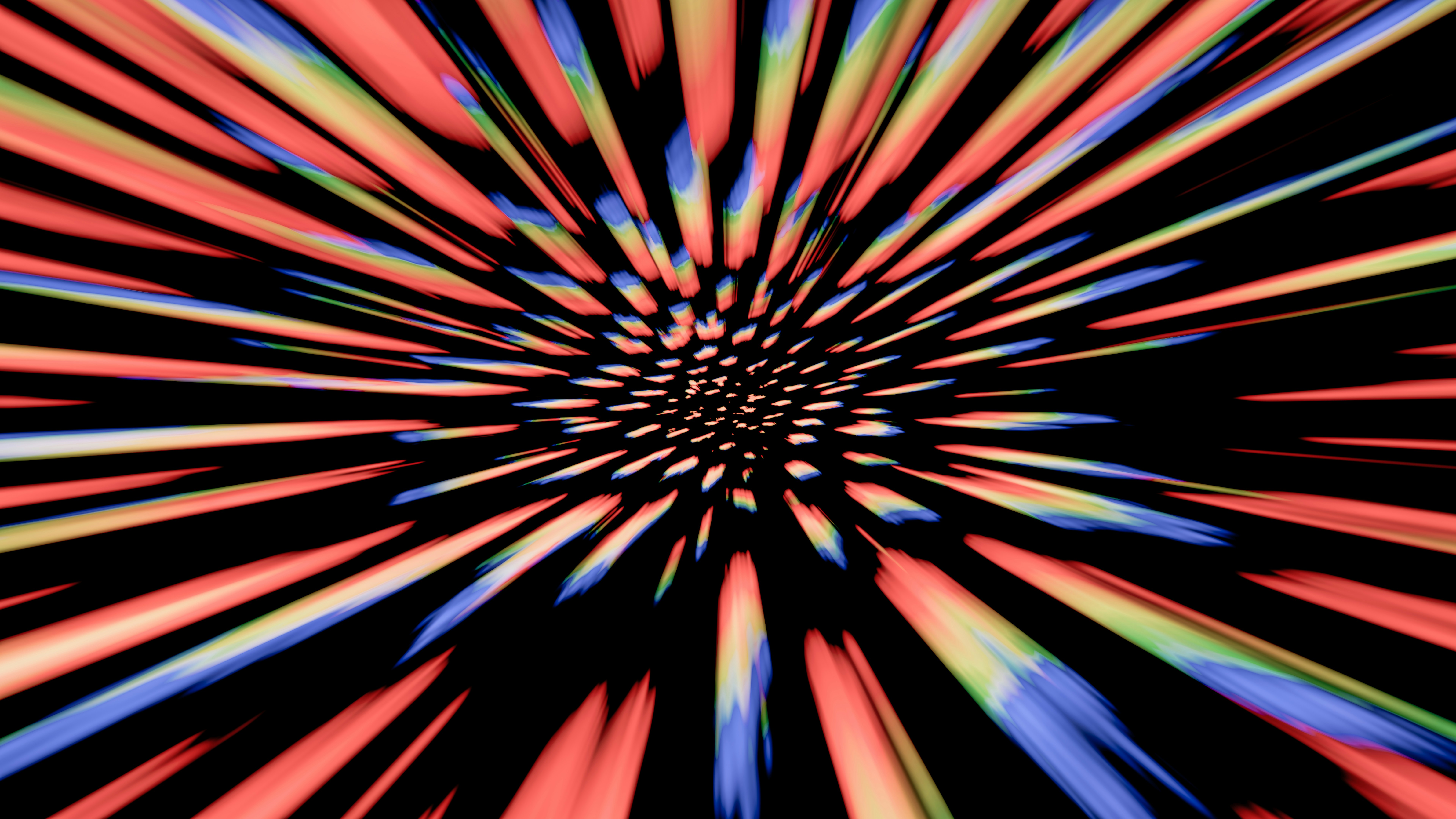 An abstract image of a starburst in red, blue, and yellow