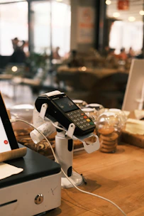 A laptop computer sitting on top of a wooden table