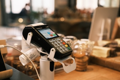 A cell phone is hooked up to a charger