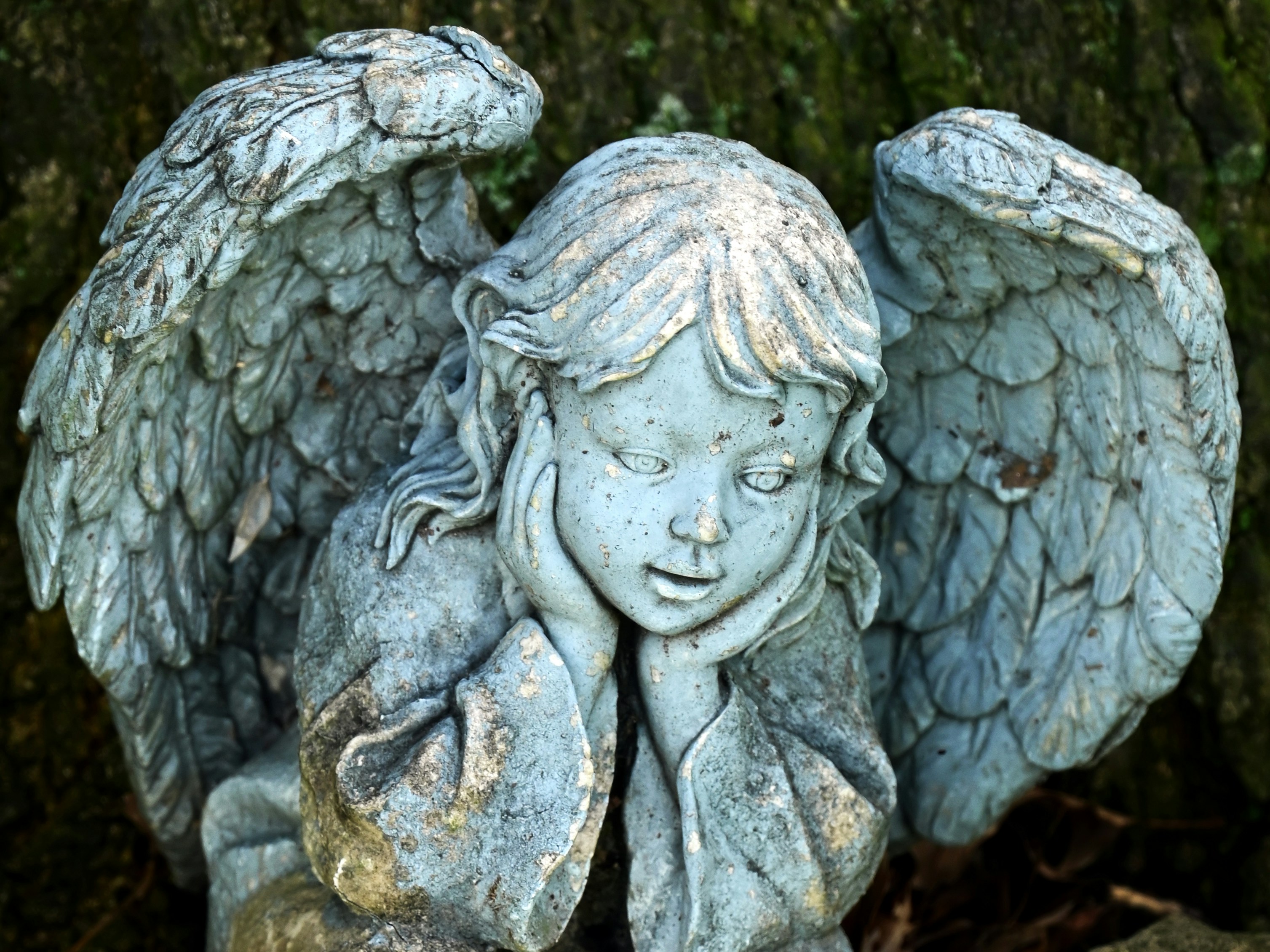 A statue of an angel holding a baby