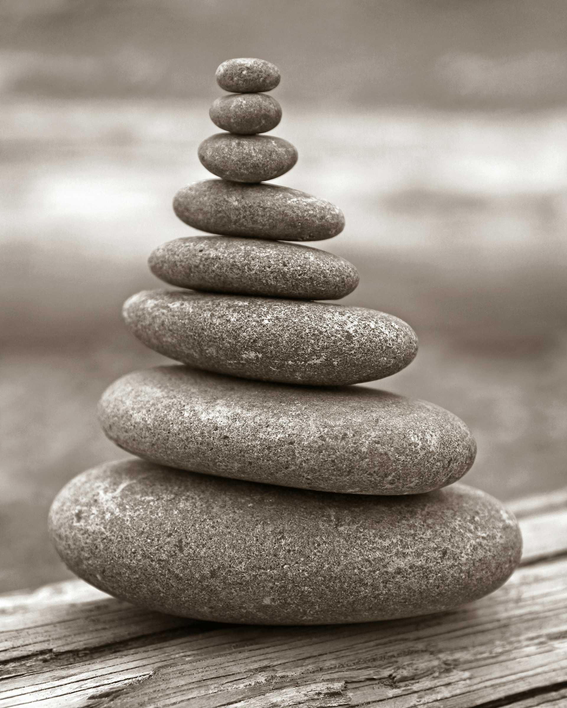A stack of rocks sitting on top of a wooden table