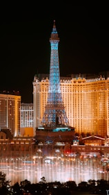 The eiffel tower lit up at night in las vegas