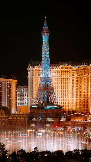 The eiffel tower lit up at night in las vegas