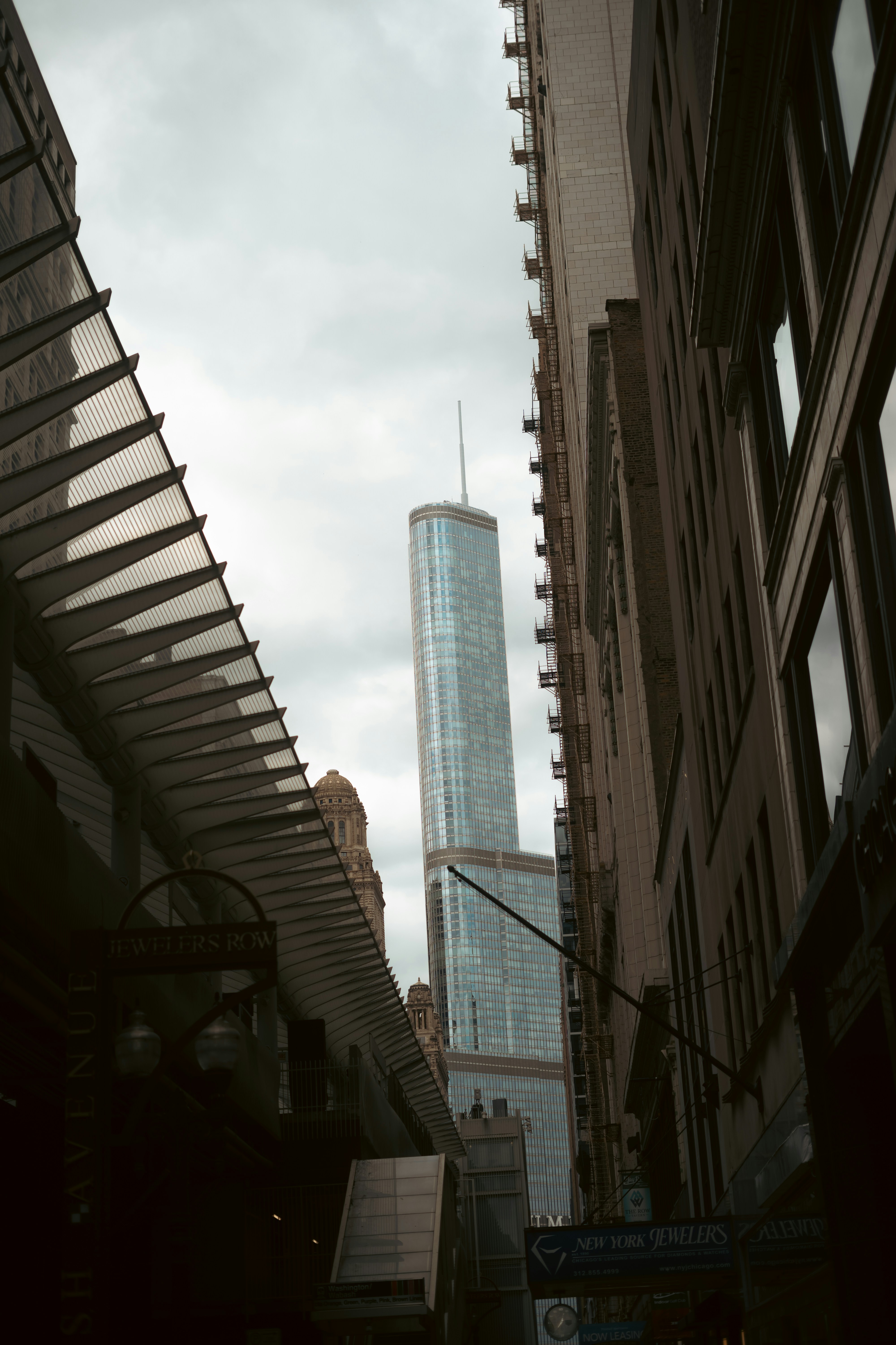 A city street with tall buildings in the background
