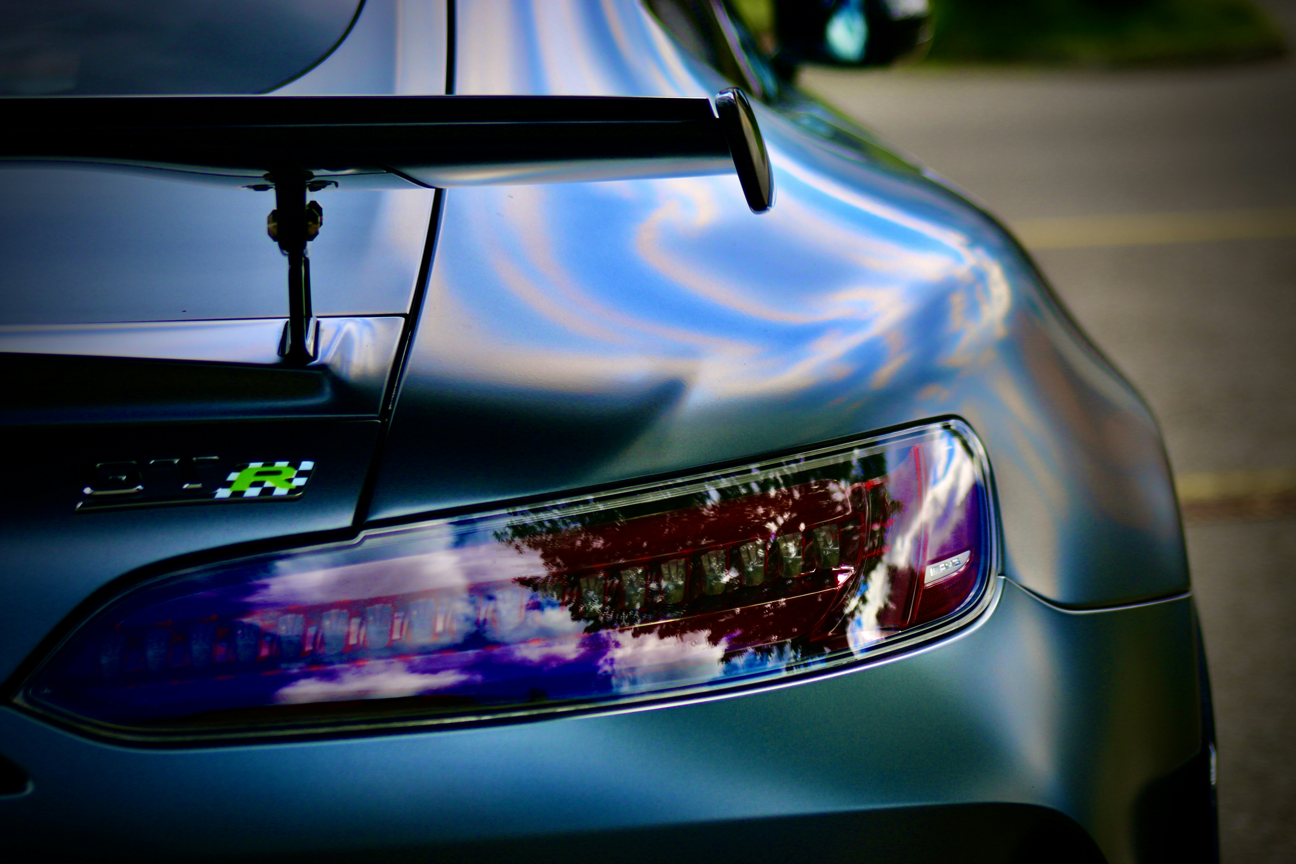 Electric car interior view showing steering wheel and center touchscreen display