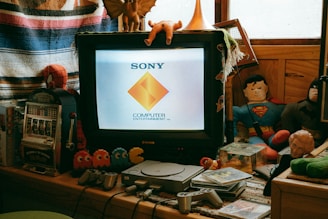 A computer monitor sitting on top of a wooden desk