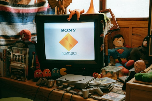 A computer monitor sitting on top of a wooden desk