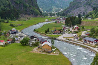 A river running through a lush green valley