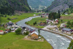 A river running through a lush green valley