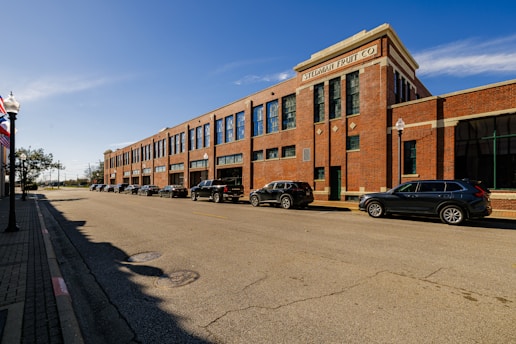 A large brick building sitting on the side of a road