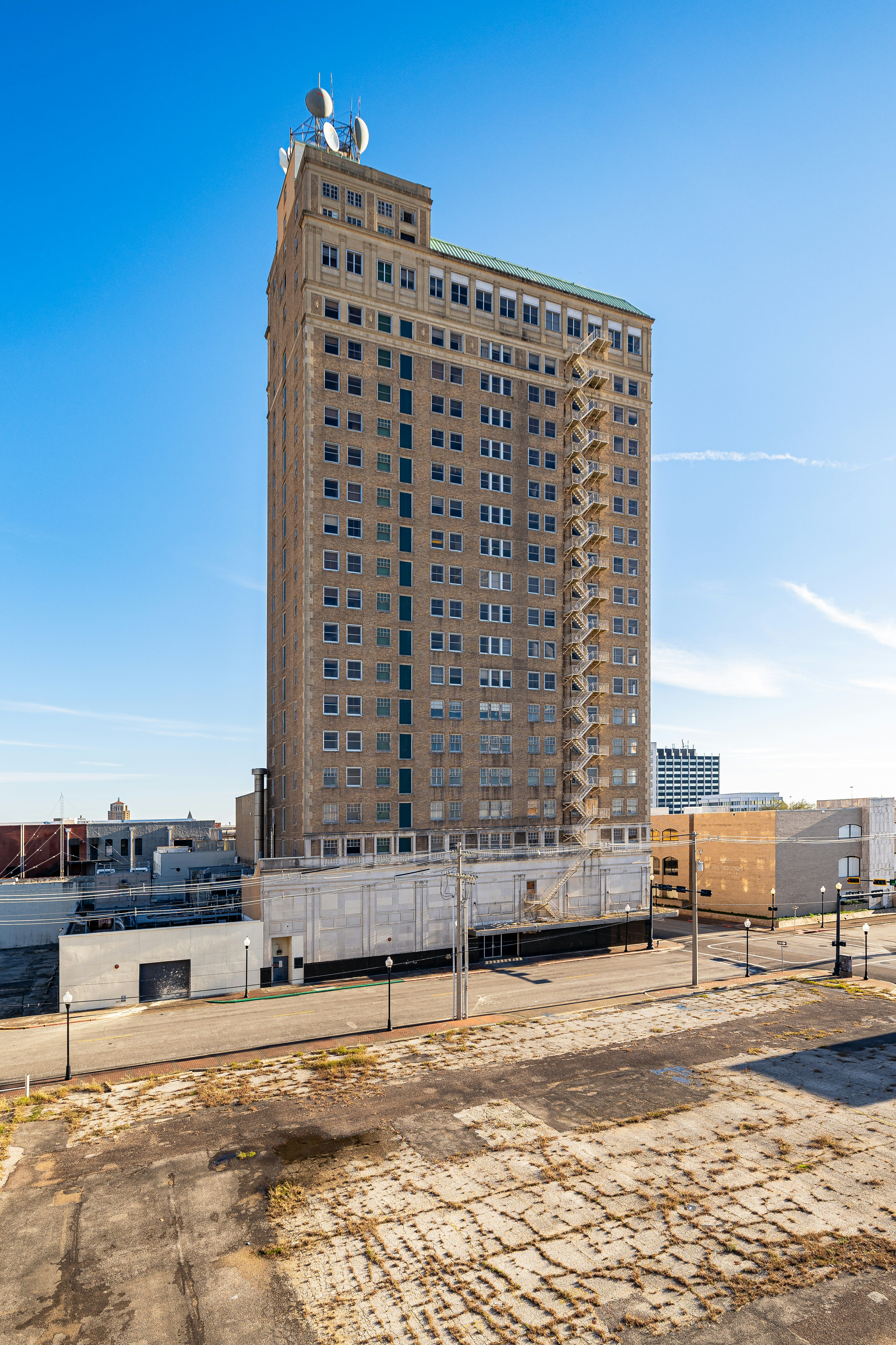 A very tall building sitting on the side of a road