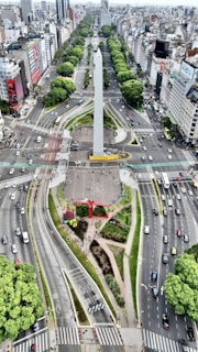An aerial view of a city with a monument in the middle