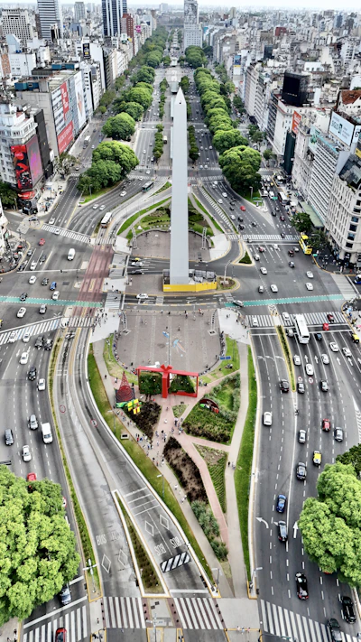 An aerial view of a city with a monument in the middle