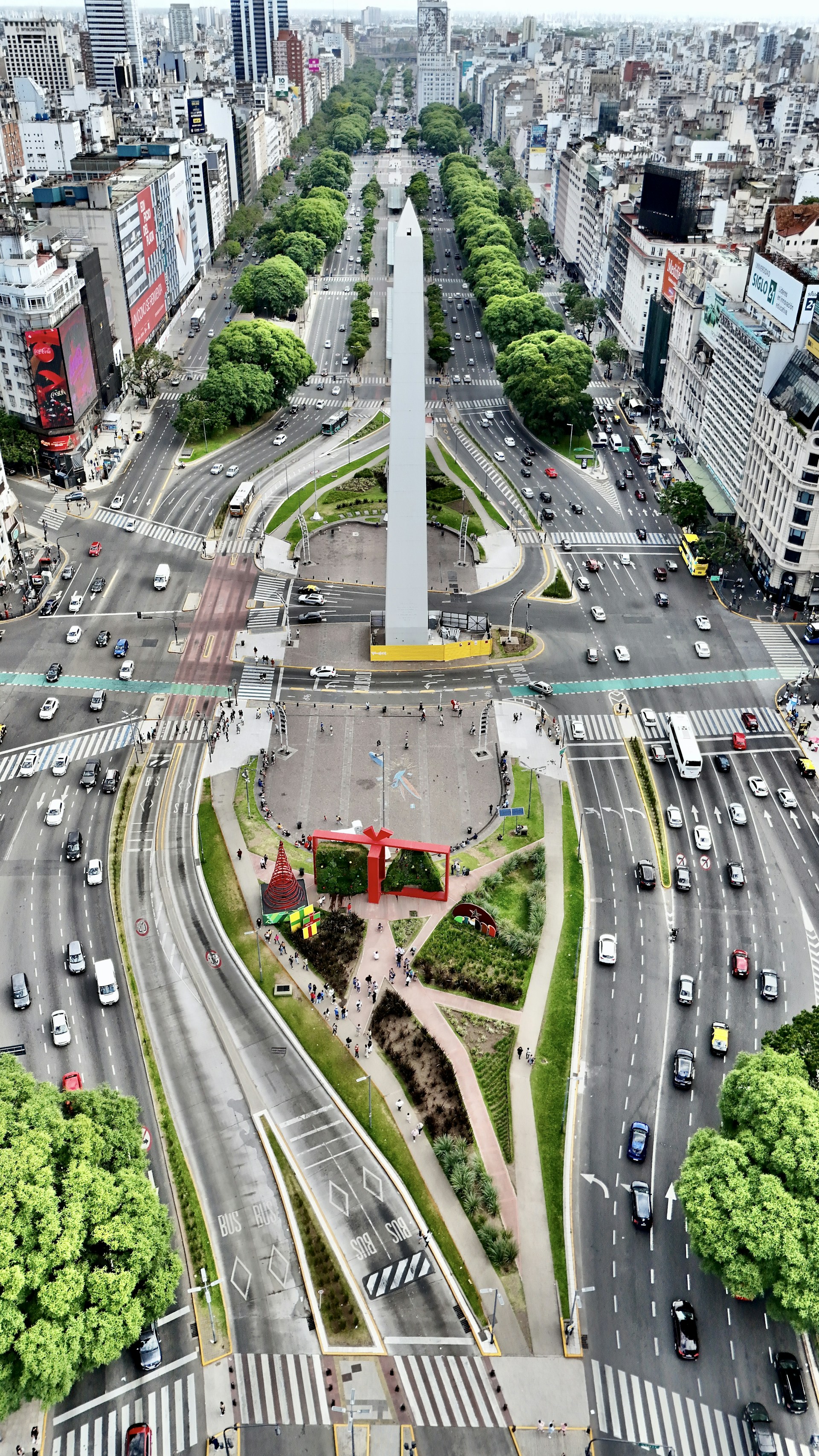 An aerial view of a city with a monument in the middle