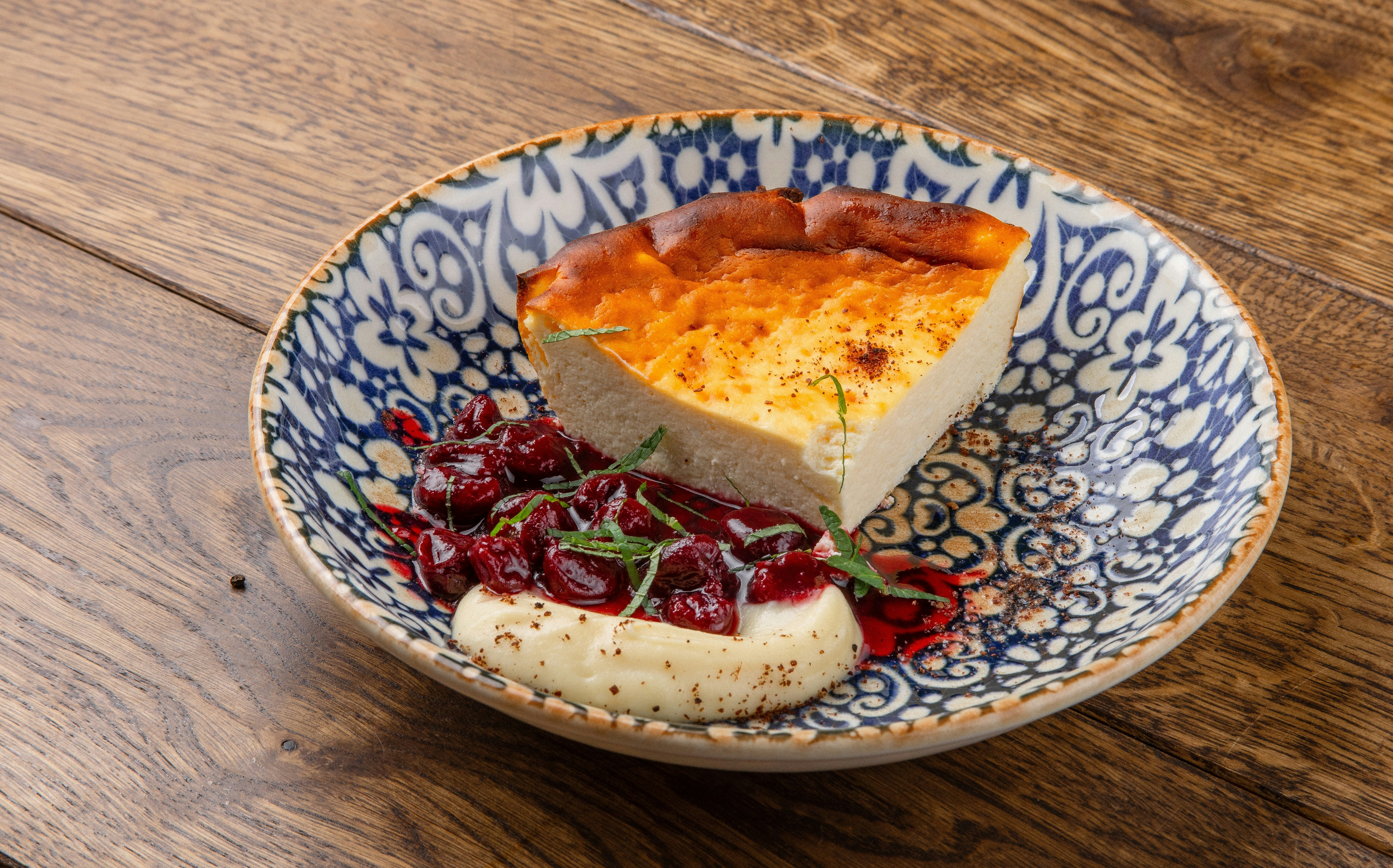 A blue and white plate topped with a slice of pie