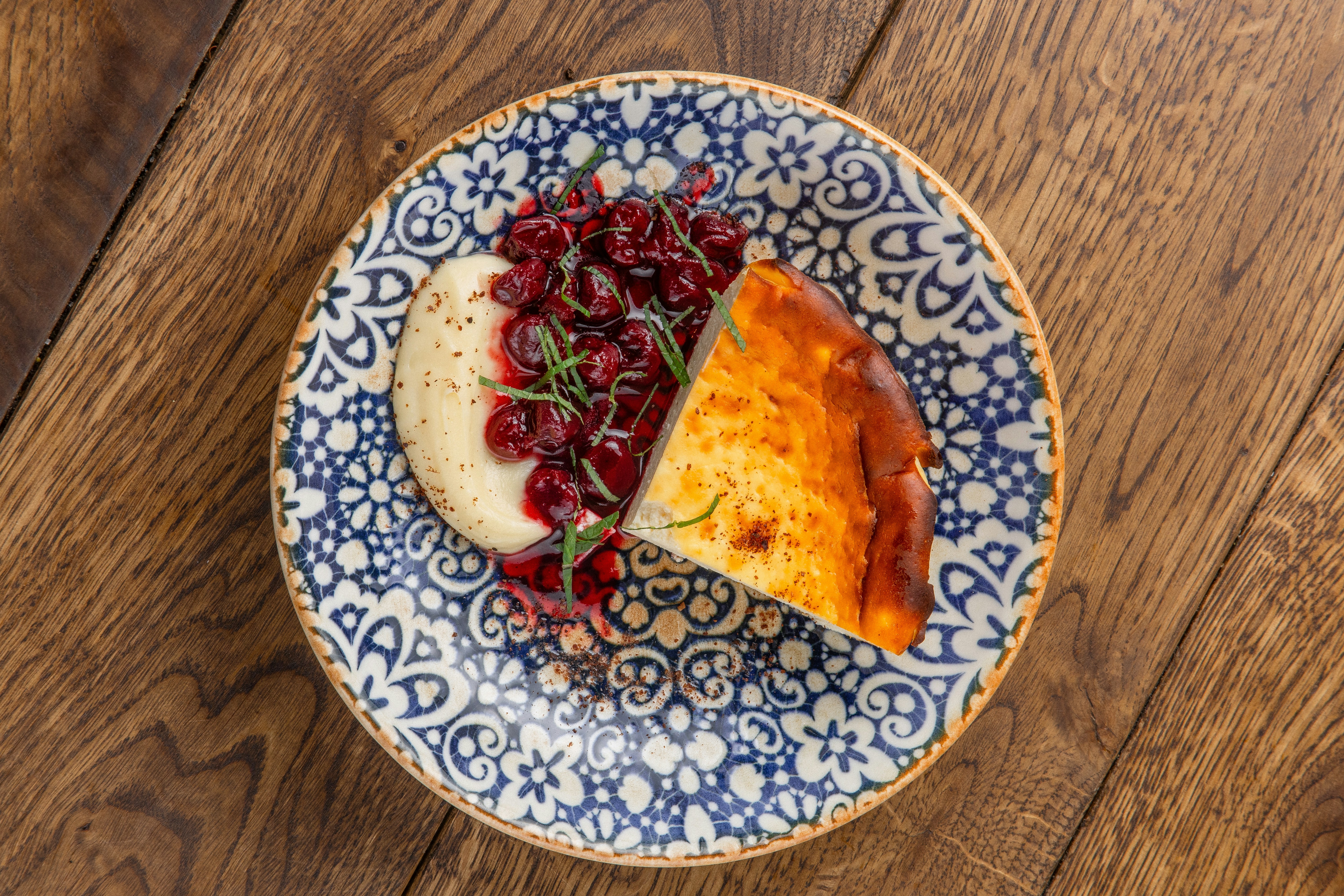 A blue and white plate topped with a slice of pie