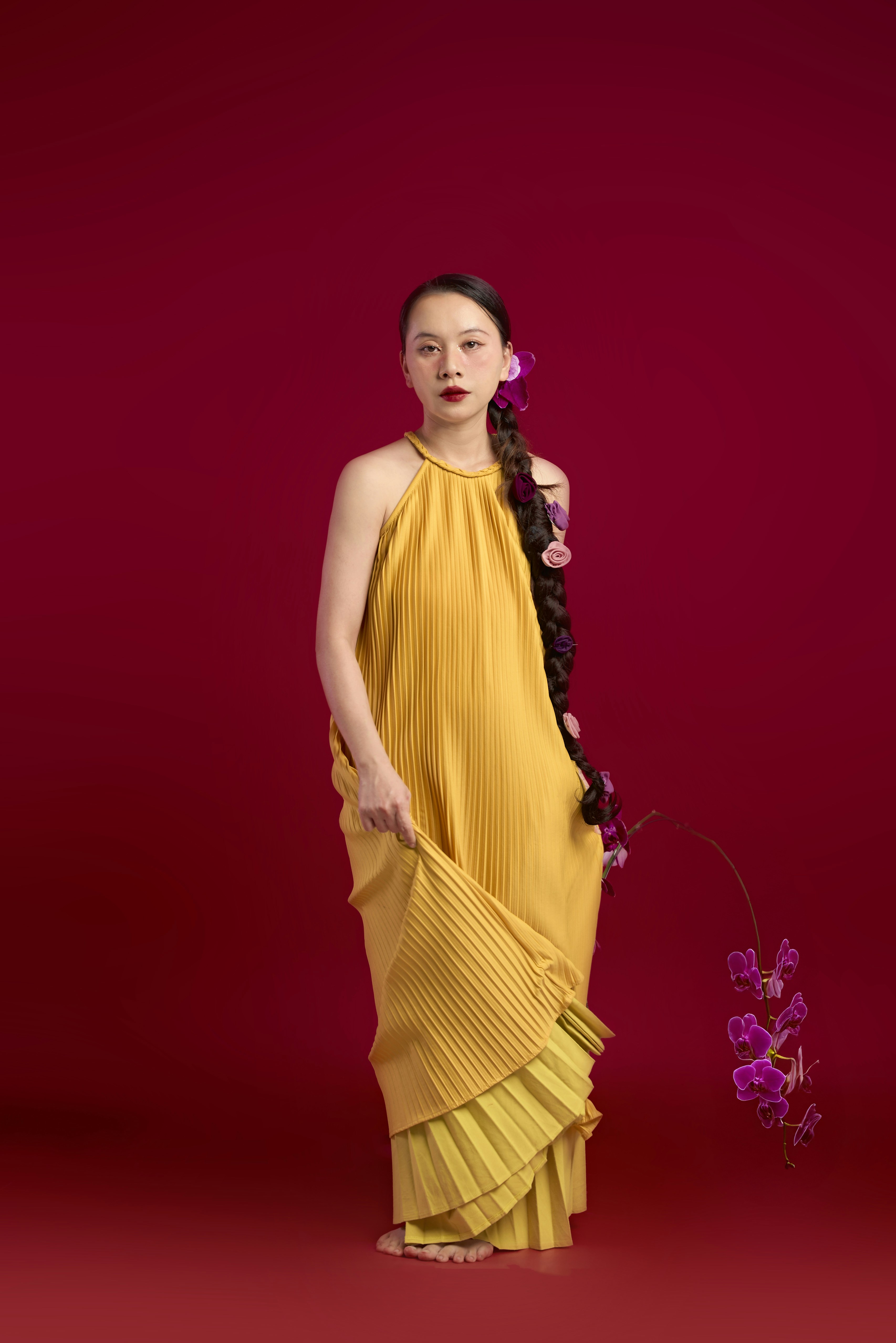 A woman in a yellow dress holding a flower photo – Free Flower Image on ...