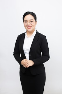 A woman in a business suit posing for a picture