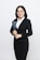 A woman in a business suit holding a folder