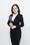 A woman in a business suit holding a folder
