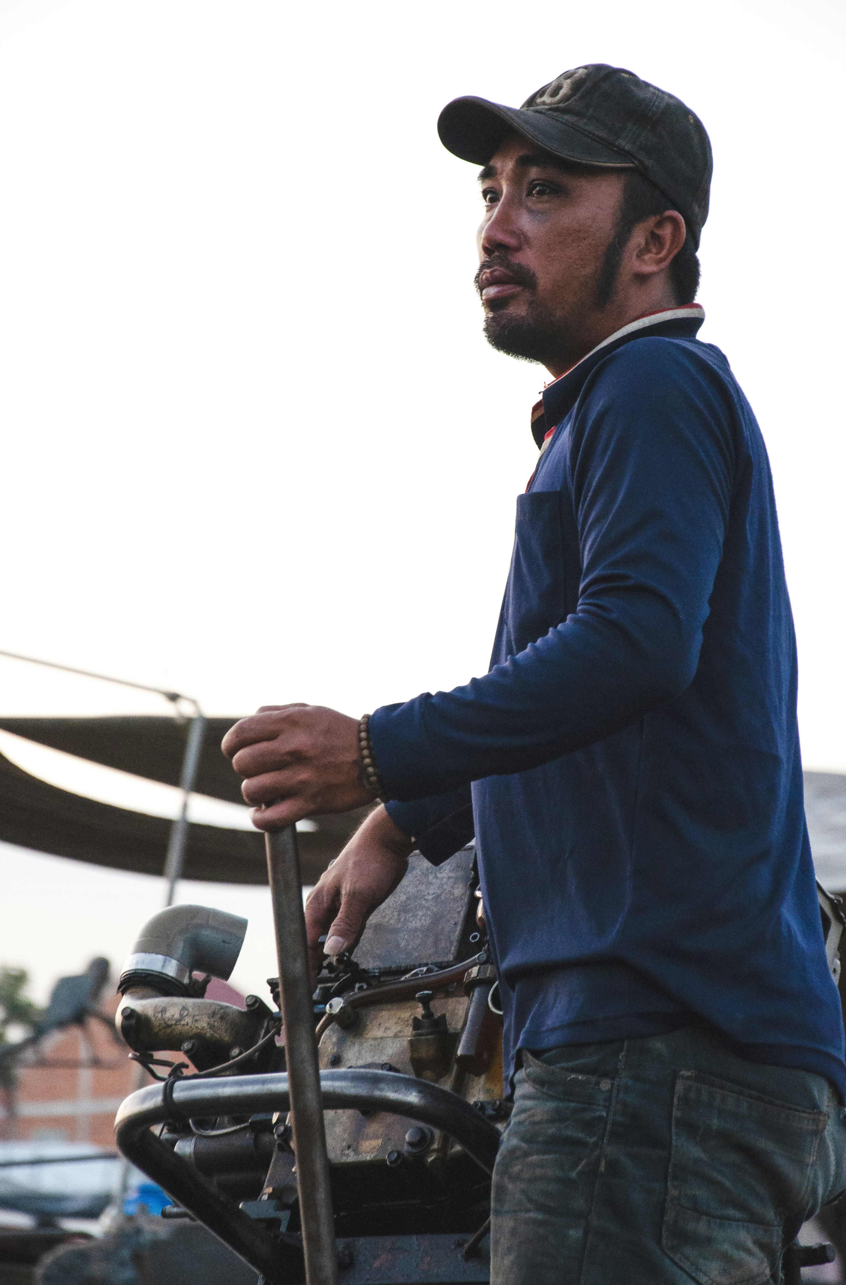 A man is standing next to a motorcycle