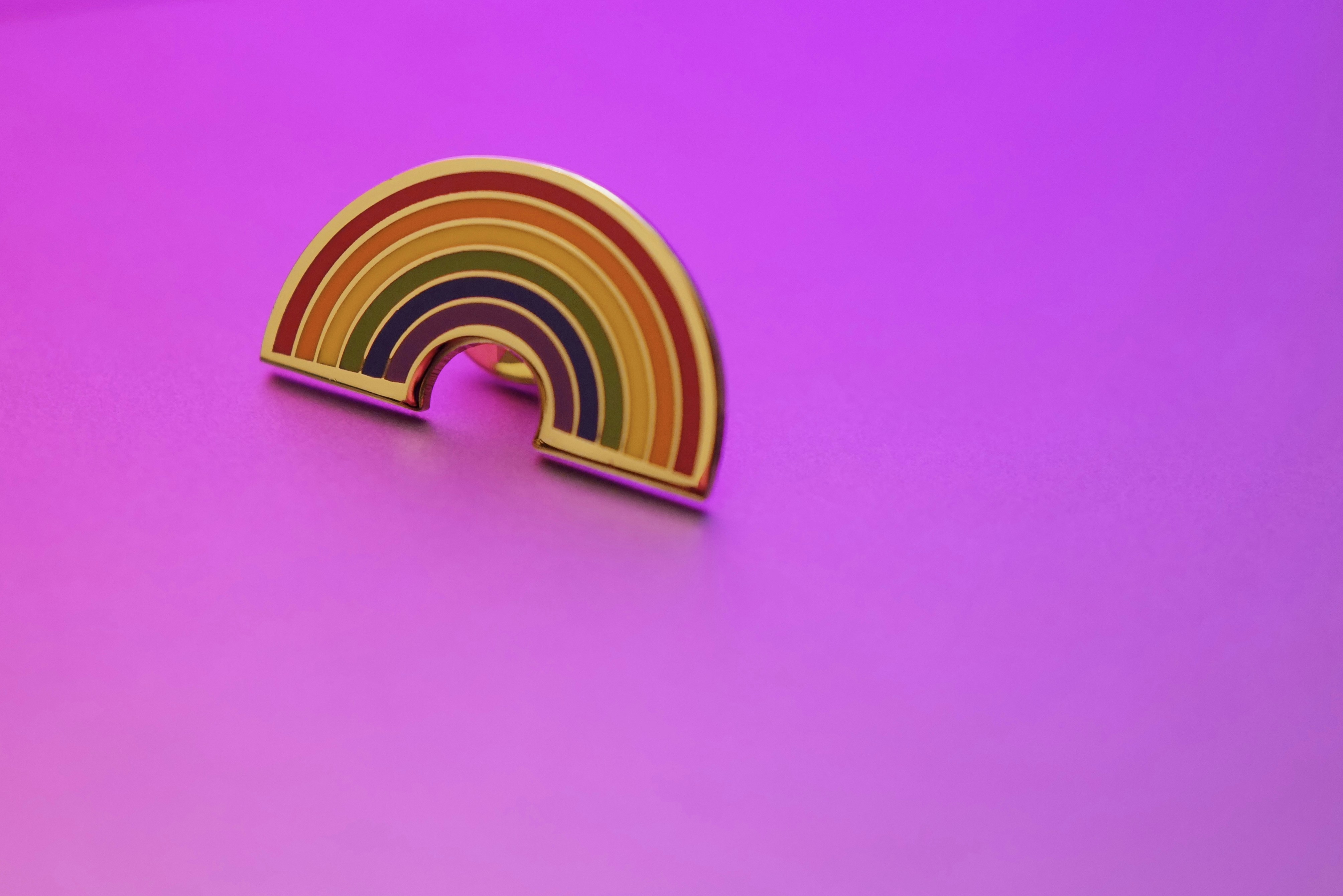 A close up of a rainbow shaped object on a table